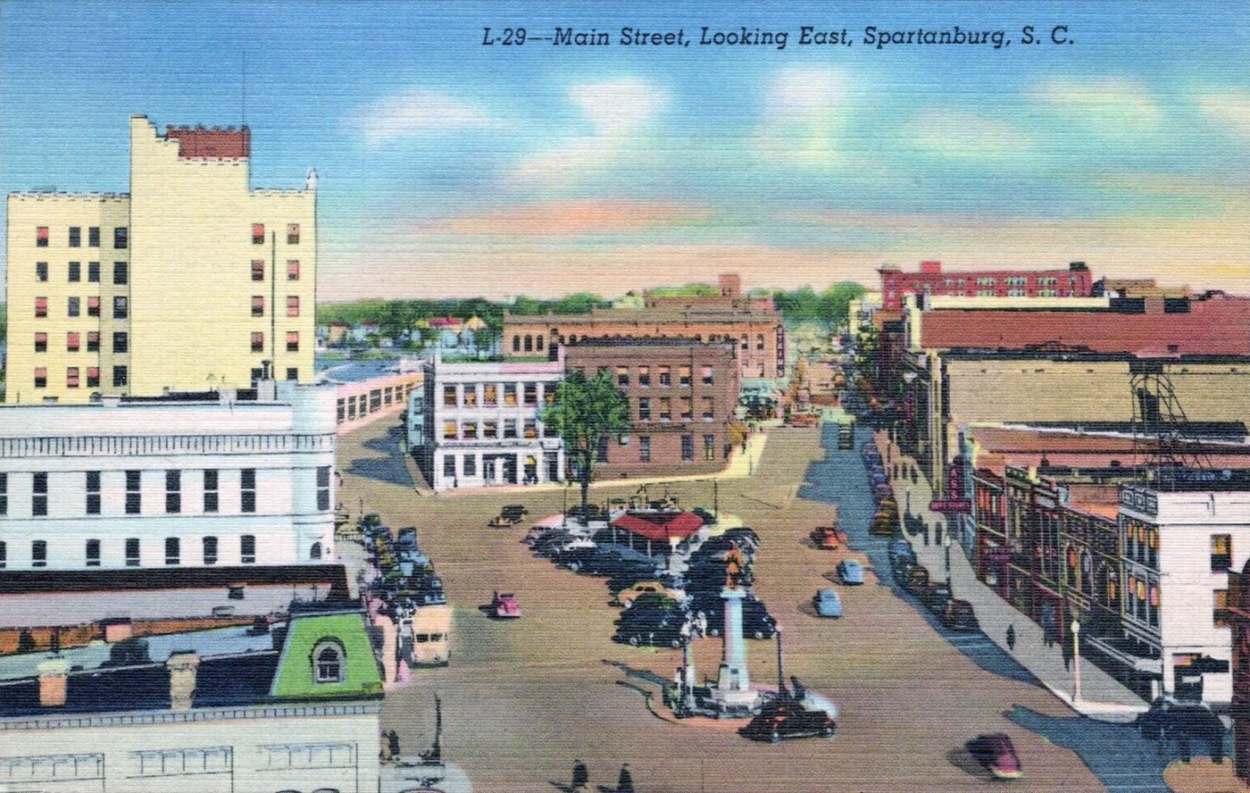 Main Street looking east in 1942, cars parked around the square